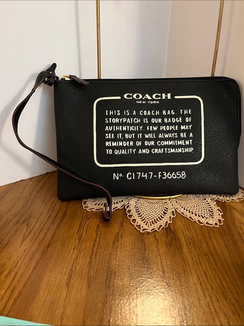 Coach Black Leather Wristlet with White Logo Text